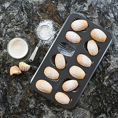 Nonstick Madeleine Pans, 12-Cavity Carbon Steel, 2-Pack, photographed on a counter.